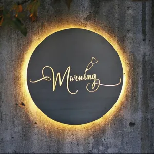 Insegna in Corten circolare con lettere intagliate e retroilluminate